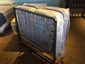 Rollaway bed folded up, small enough to fit in a walk in closet!